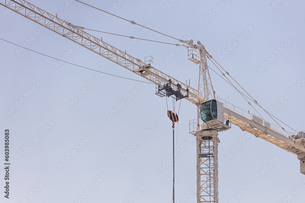 Construction crane at sky bavkground.