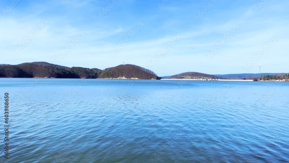 Breathtaking view of Lake Solina and Solina Dam in scenic Bieszczady Mountains. Serene waters, stunning landscapes, and impressive engineering merge in this captivating film. Breathtaking view of Lake Solina and Solina Dam in scenic Bieszczady Mountains. Serene waters, stunning landscapes, and impressive engineering merge in this captivating film.