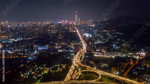 Wallpaper Mural TAIWAN, TAIPEI - MAY, 2023: Aerial drone timelapse hyperlapse view of the busy traffic in city downtown streets at rush hour, with 101 Tower among crowded buildings in Xinyi District, Taipei Torontodigital.ca