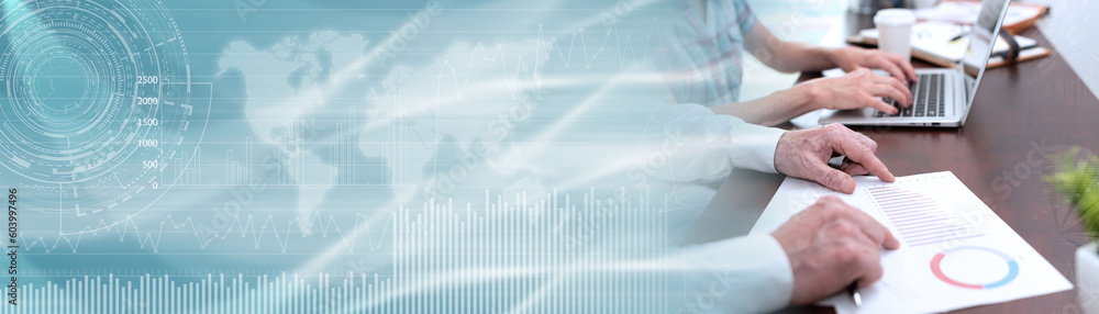 Coworkers analyzing financial data; panoramic banner Coworkers analyzing financial data; panoramic banner