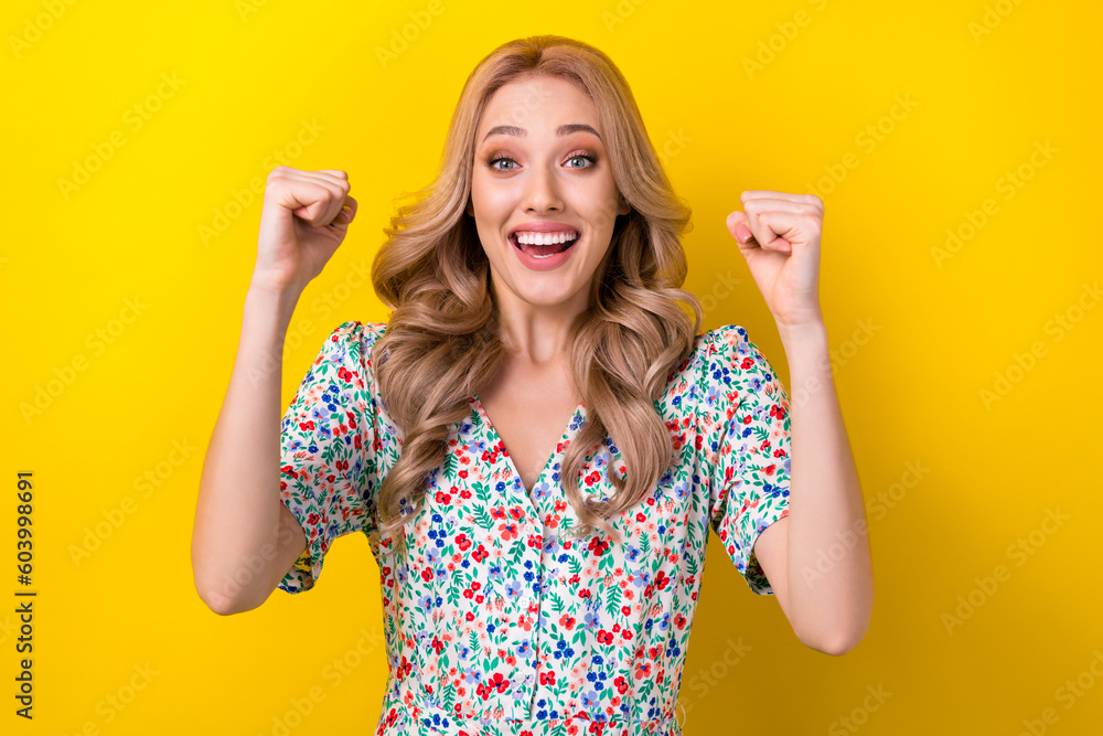 Portrait of overjoyed candid cute lady wear stylish clothes raise two hands rejoice win beauty contest isolated on yellow color background Portrait of overjoyed candid cute lady wear stylish clothes raise two hands rejoice win beauty contest isolated on yellow color background