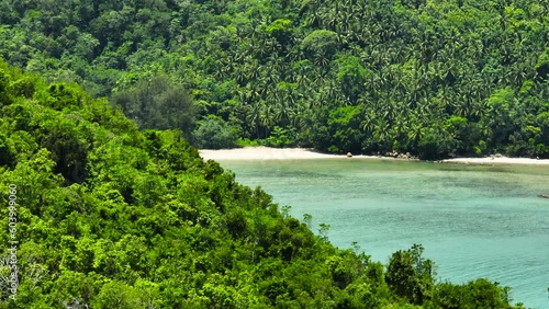 Sandy beach and turquoise water in the tropics. Borneo, Malaysia. photo