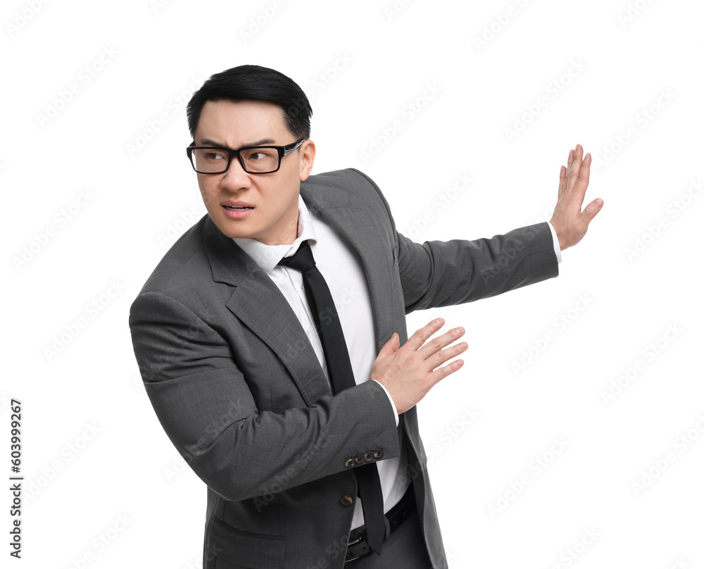 Scared businessman in suit posing on white background Scared businessman in suit posing on white background
