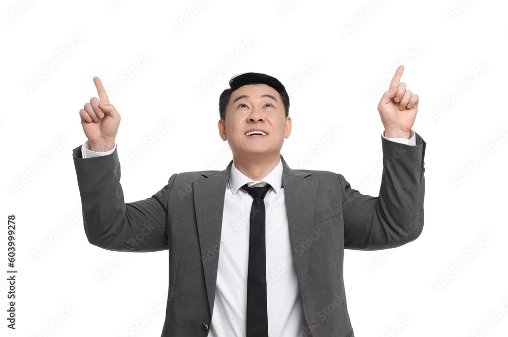 Businessman in suit pointing at something on white background Businessman in suit pointing at something on white background
