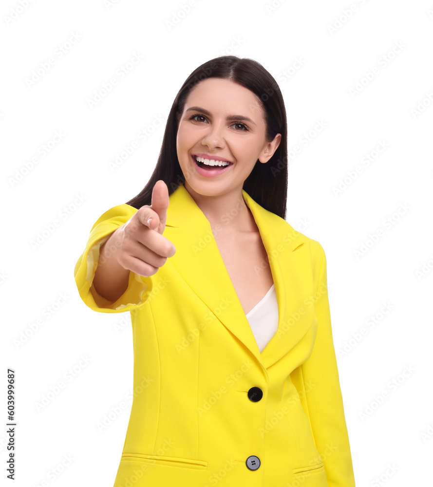 Beautiful happy businesswoman in yellow suit pointing at something on white background Beautiful happy businesswoman in yellow suit pointing at something on white background