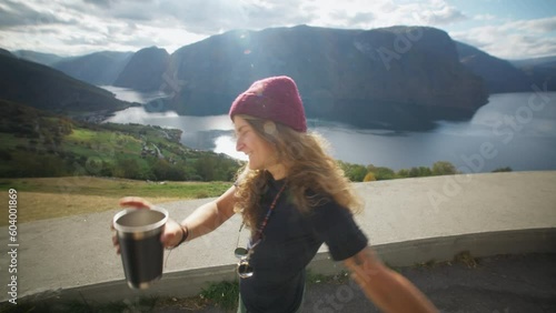 Wallpaper Mural Amazing wanderlust vibes travel couple bloggers walk out of side door of adventure camper van. Man pass coffee cup to woman, look at epic Norway views. Travel influencer lifestyle and camper roadtrip Torontodigital.ca