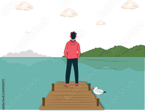 Boy standing alone on the lake
