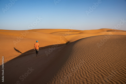 Walking in desert sand dunes  Wahiba Sands  Ash Sharqiyah  Oman