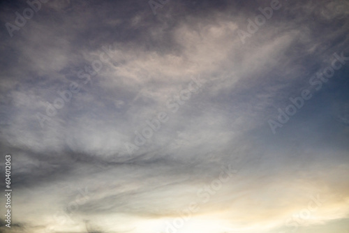 Numerous fluffy clouds in the sky at sunset. © Horacio Selva