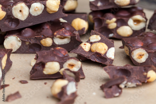 Pieces of homemade milk chocolate with lots of hazelnuts