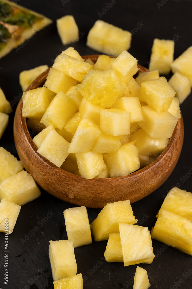 sliced ripe yellow pineapple, a large number of pieces sliced ripe yellow pineapple, a large number of pieces