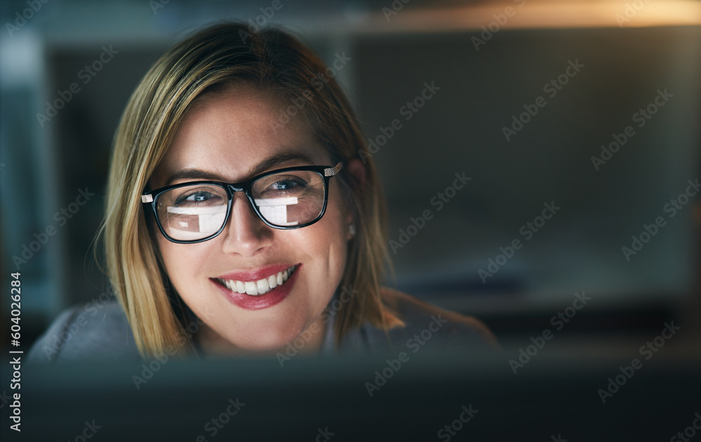 Happy, businesswoman and working late on a computer or overtime for a project deadline or schedule and in an office. Research, email and corporate worker with smile or analysis and report at night