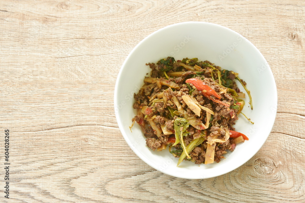 spicy stir fried bamboo shoot and chop beef meat with basil leaf in bowl spicy stir fried bamboo shoot and chop beef meat with basil leaf in bowl