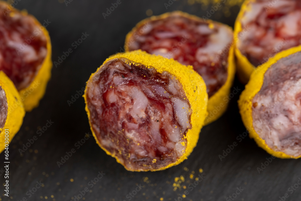marinated in young turmeric pork sausage on black slate marinated in young turmeric pork sausage on black slate
