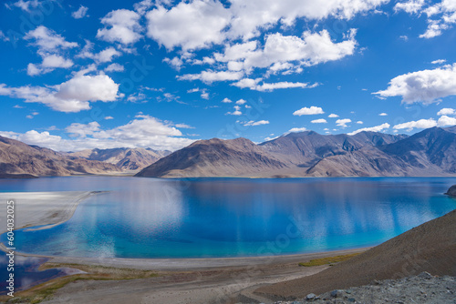  Mountains and Pangong tso (Lake). It is huge lake in Ladakh, altitude 4,350 m (14,270 ft). It is 134 km (83 mi) long and extends from India to Tibet. Leh, Ladakh, Jammu and Kashmir, India
