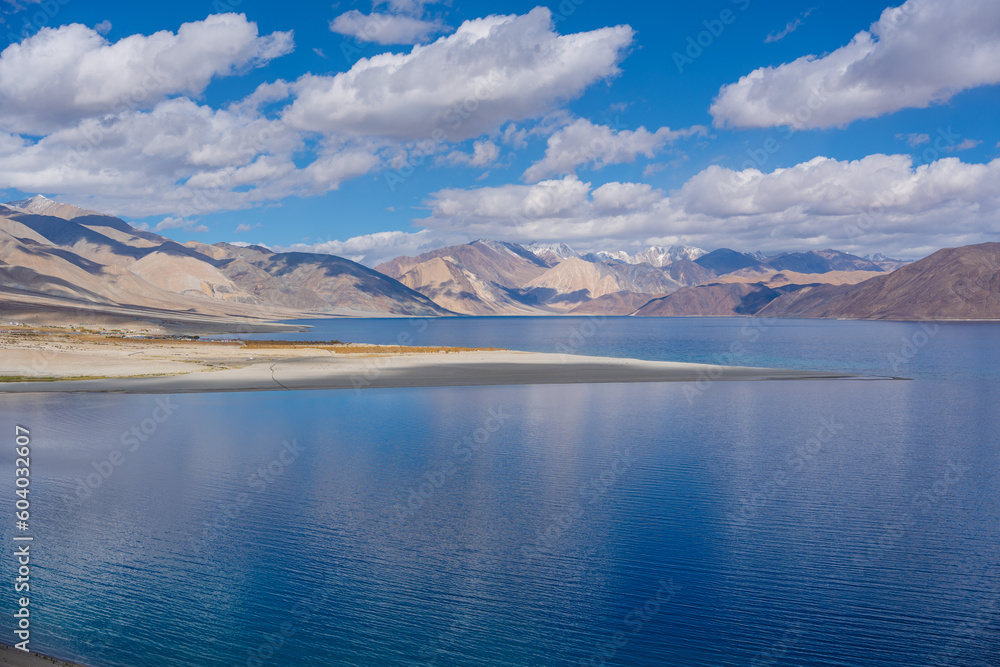 Mountains and Pangong tso (Lake). It is huge lake in Ladakh, altitude 4,350 m (14,270 ft). It is 134 km (83 mi) long and extends from India to Tibet. Leh, Ladakh, Jammu and Kashmir, India Mountains and Pangong tso (Lake). It is huge lake in Ladakh, altitude 4,350 m (14,270 ft). It is 134 km (83 mi) long and extends from India to Tibet. Leh, Ladakh, Jammu and Kashmir, India