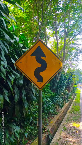 winding road warning signs
