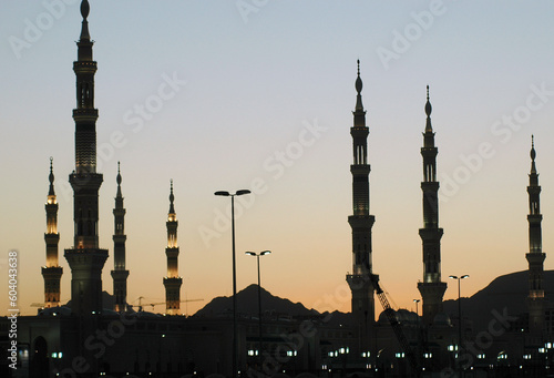 Mosque at sunset  Minarets of Masjid an-Nabawi  Evening time. Medina  Saudi Arabia.