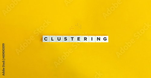 Clustering or Cluster Analysis. Machine learning and data mining concept. Block Letter Tiles on Yellow Background. Minimal Aesthetics.