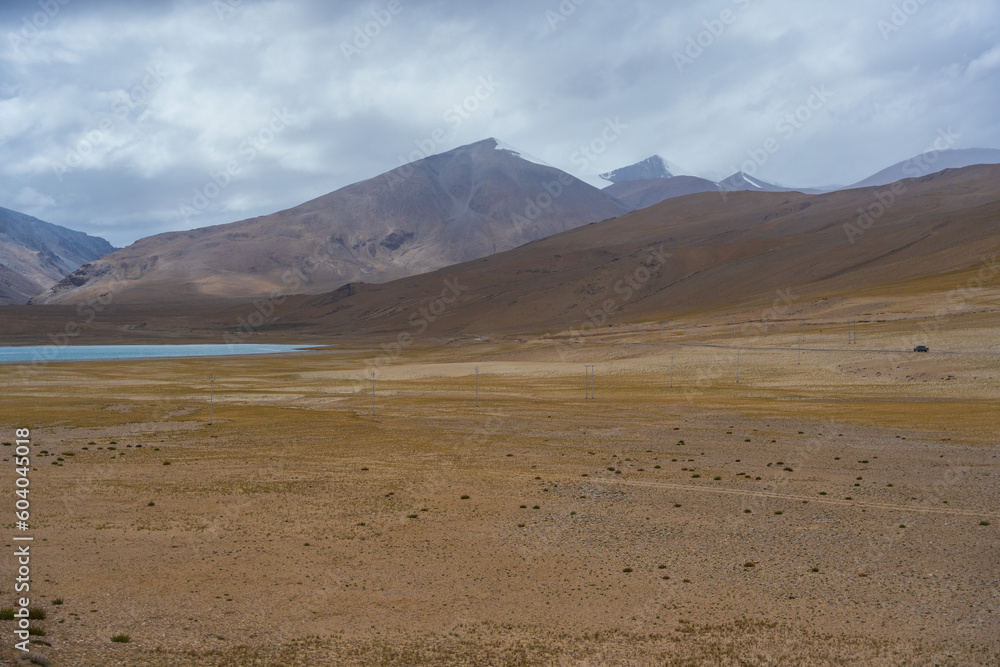 Landscape of Desert mountains against clouds sky at the way from Pangong Lake to Tso Moriri, Leh, Ladakh, Jammu and Kashmir, India