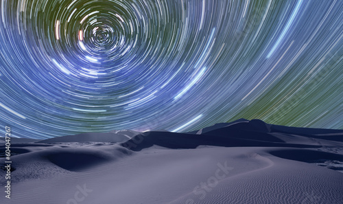 Long exposure photo of night sky star trail over the sand dunes of Sahara Desert - Sahara, Morocco