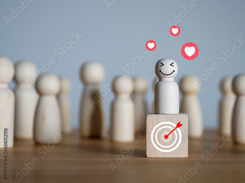 Happy smiley face and red heart. On a wooden man filed on a successful goal, in a good mood from the surroundings think positively from the problems encountered optimistic