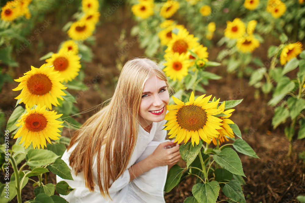 Happy girl on the field of sunflowers in summer. beautiful little girl in sunflowers Happy girl on the field of sunflowers in summer. beautiful little girl in sunflowers