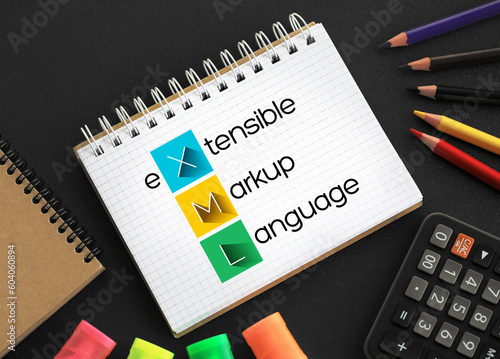XML - eXtensible Markup Language acronym on notepad, technology concept background photo