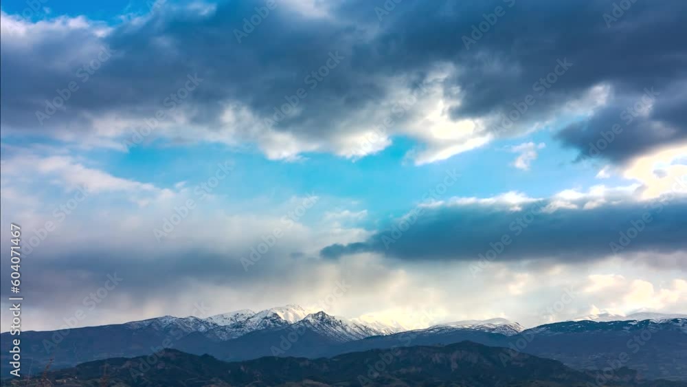 time-lapse of clouds over the mountains in cyan view time-lapse of clouds over the mountains in cyan view