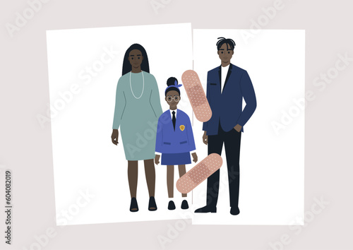 A reverse divorce concept, a family photo torn in two pieces and glued together with an adhesive tape, a separation process, a couple therapy