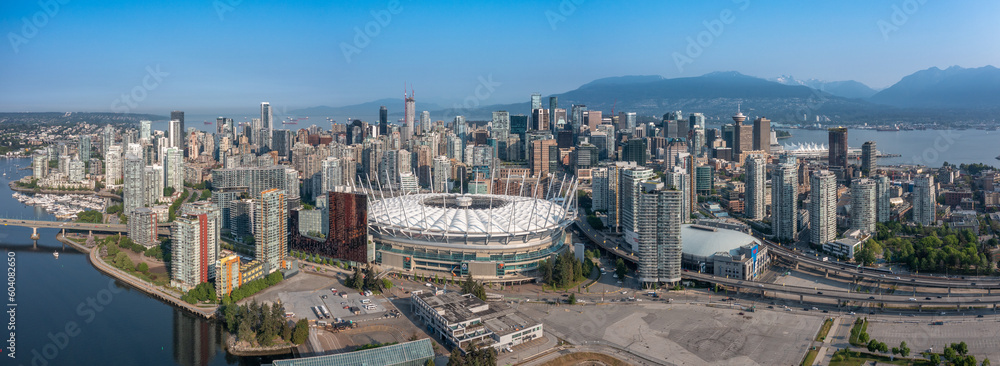 Vancouver, BC, Canada, aerial panoramic city view of famous False Creek in Vancouver downtown with Cambie Bridge and BC Place Stadium in front and Vancouver Skyline in the background 