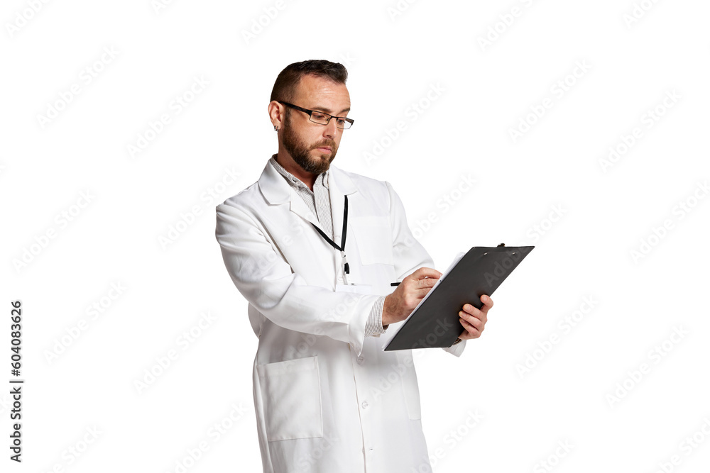 Portrait of serious man, doctor in white lab coat standing, writing information in medical papers against white background. Concept of medicine, occupational, healthcare, profession Portrait of serious man, doctor in white lab coat standing, writing information in medical papers against white background. Concept of medicine, occupational, healthcare, profession