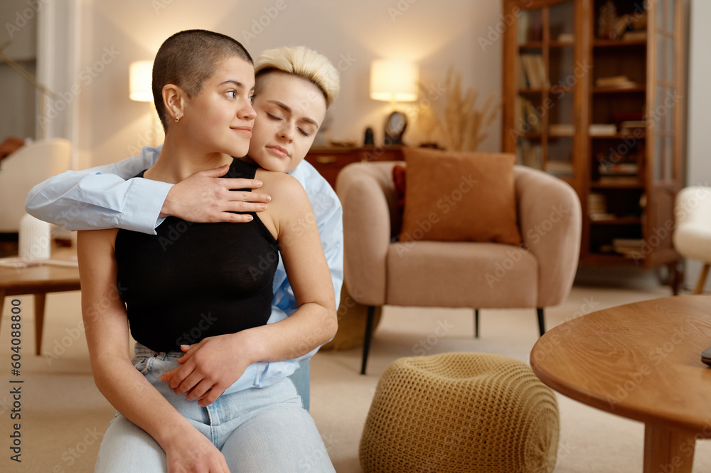 Excited romantic lesbian woman couple hugging feeling happiness to be parents Excited romantic lesbian woman couple hugging feeling happiness to be parents