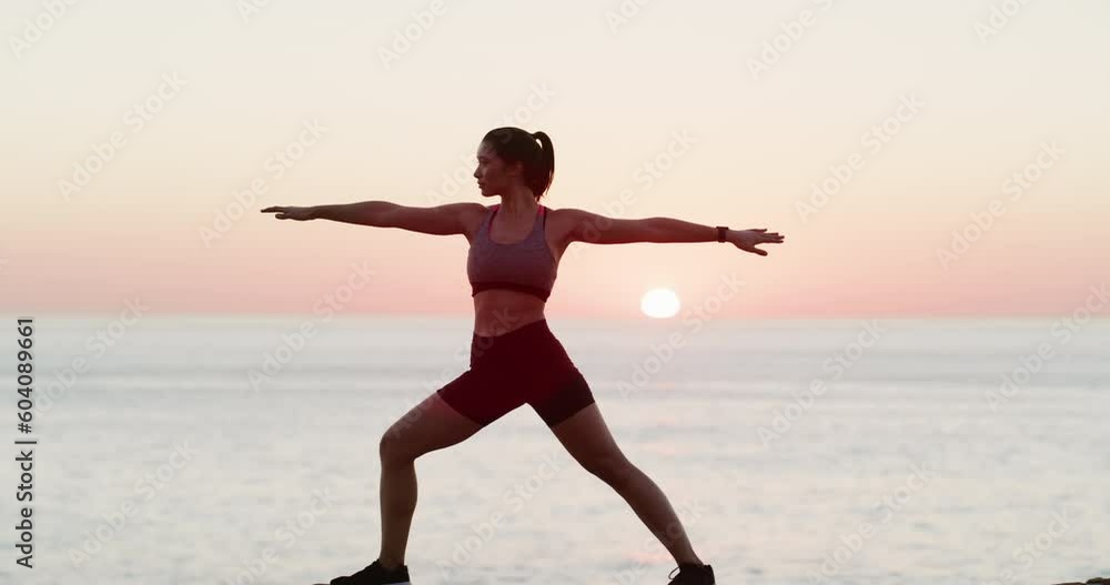 Yoga, sunset and a woman at the beach for fitness, wellness and training in peace. Exercise, ocean and a young girl at the sea for health, pilates and stretching with a pose for a workout in evening Yoga, sunset and a woman at the beach for fitness, wellness and training in peace. Exercise, ocean and a young girl at the sea for health, pilates and stretching with a pose for a workout in evening