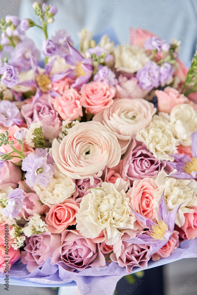 Beautiful bouquet of flowers in woman hand. Floral shop concept . Beautiful fresh cut bouquet. Flowers delivery Beautiful bouquet of flowers in woman hand. Floral shop concept . Beautiful fresh cut bouquet. Flowers delivery