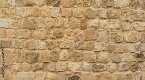 Stone wall background, limestone wall texture