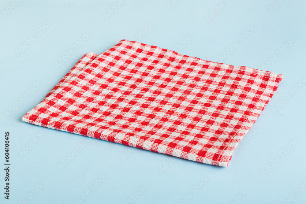 top view with red empty kitchen napkin isolated on table background. Folded cloth for mockup with copy space, Flat lay. Minimal style top view with red empty kitchen napkin isolated on table background. Folded cloth for mockup with copy space, Flat lay. Minimal style