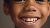 The smile of an African-American 7-year-old boy. Portrait of a laughing boy with beautiful white teeth. Healthy teeth, dentistry. Generated by AI Generative AI