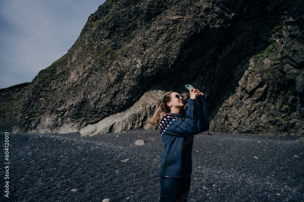Fototapeta premium traveler on halsanefshellir cave, Reynisfjara, Iceland