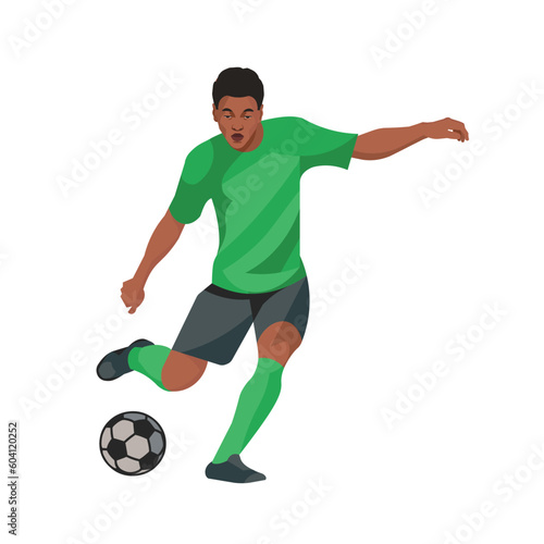 Dark-skinned football player in a green sports uniform is going to kick the ball with his foot