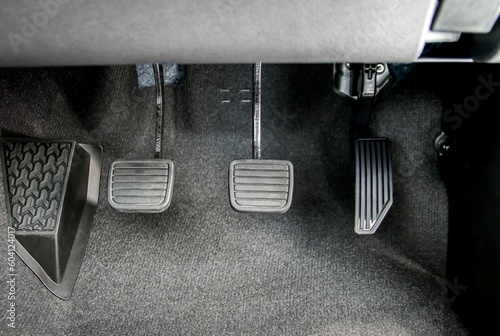 Accelerator, brake pedal and clutch pedal of manual gear car photo