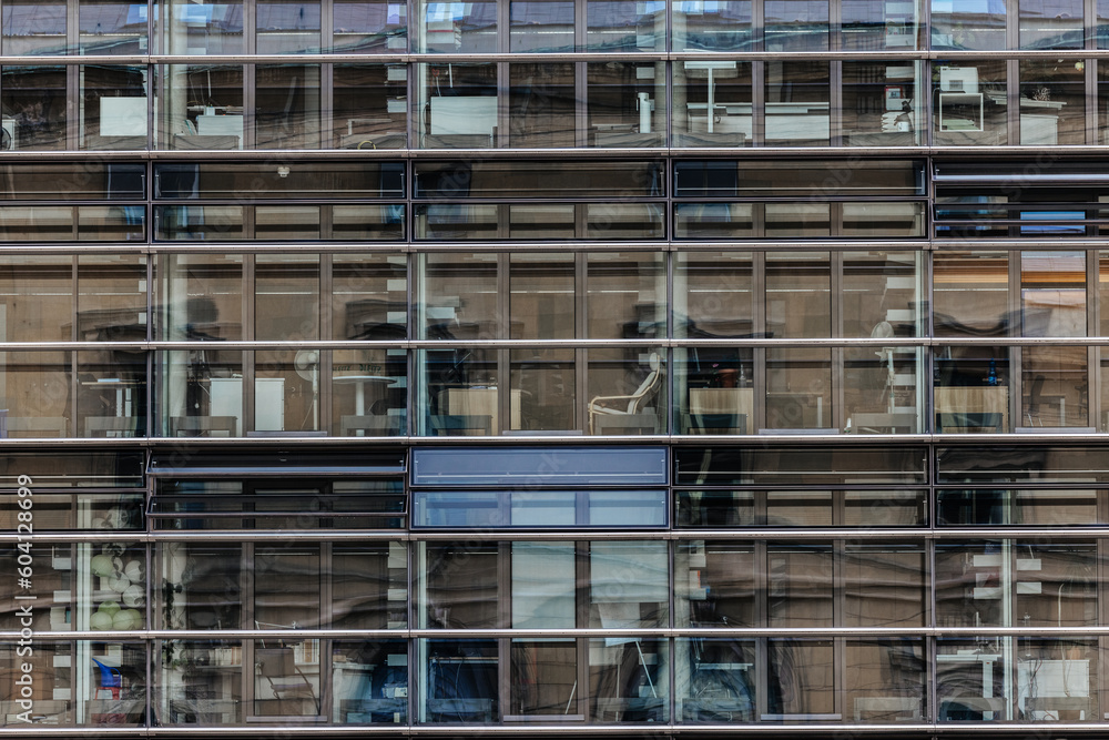 Glass window facade and reflections on an office building in Munich, Germany