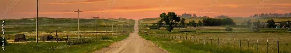 a county gravel road runs through farm land in north eastern Colorado east of Sterling a county gravel road runs through farm land in north eastern Colorado east of Sterling