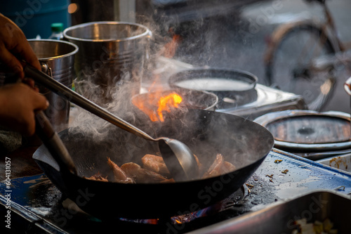 Pad Thai favorite and famous Asian Thai street fast food in hot pan, Pad Thai is stir fried rice noodle dish commonly served as a street food and at casual local eateries in Thailand