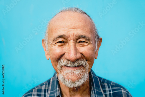 Happy senior man having fun looking and smiling into the camera - Elderly people lifestyle concept