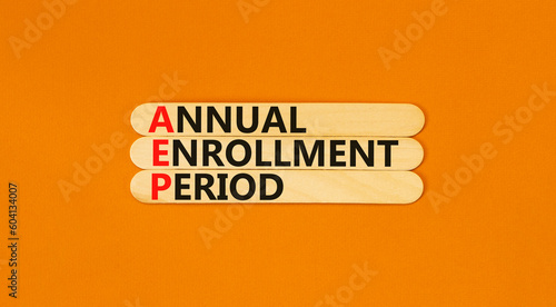 AEP symbol. Concept words AEP Annual enrollment period on beautiful wooden sticks. Beautiful orange table orange background. Medical and AEP Annual enrollment period concept. Copy space. photo