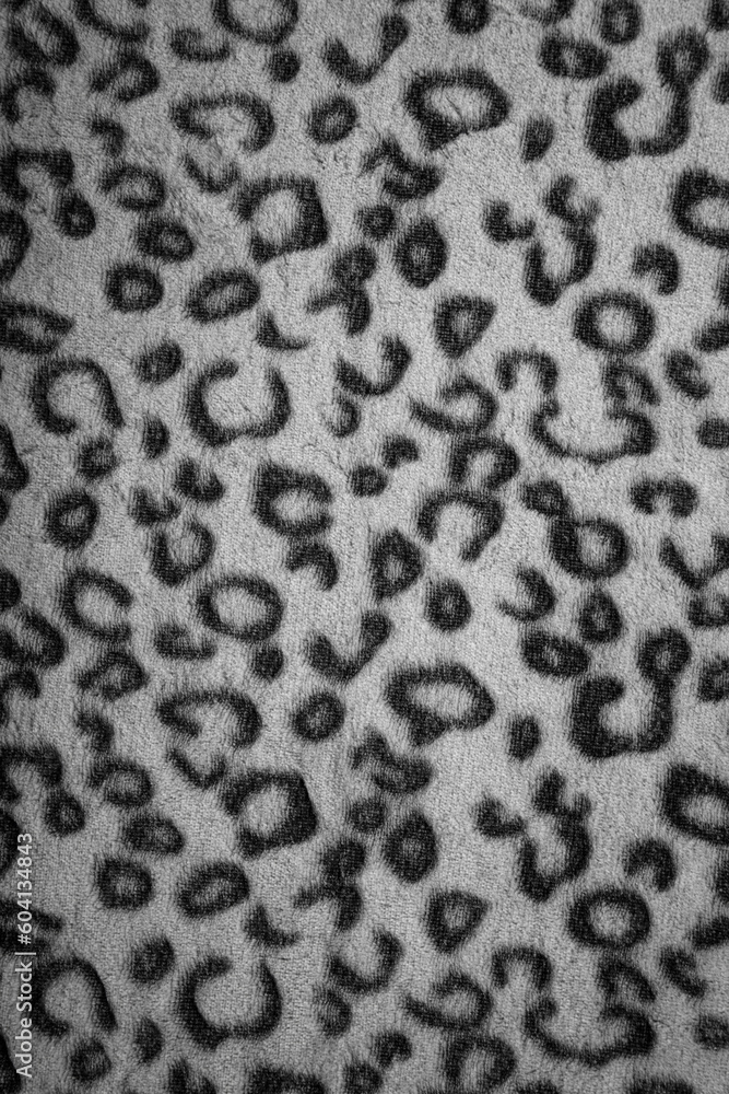 Soft fleecy faux fabric with a mottled pattern. Light leopard texture. Soft fleecy faux fabric with a mottled pattern. Light leopard texture.