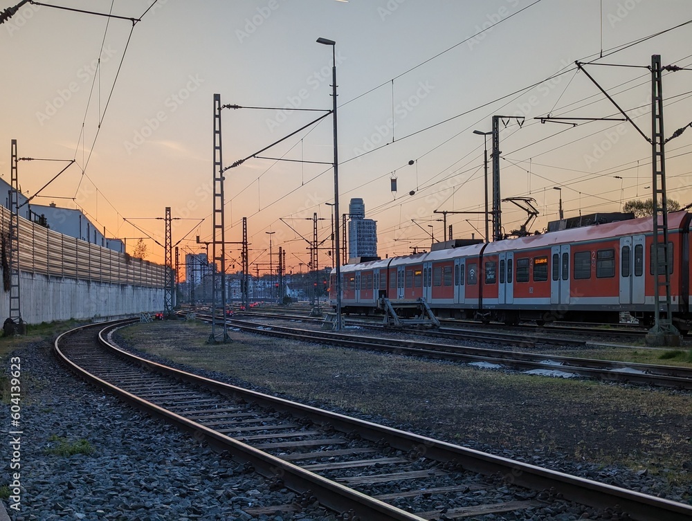 Pure peace in the morning with the sun rising next to quiet train tracks Pure peace in the morning with the sun rising next to quiet train tracks