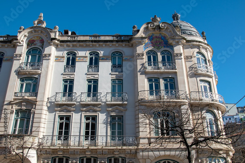 Facade of an old house with vintage street lamps, European cityscape, view of Portuguese city, Lisbon, Portugal