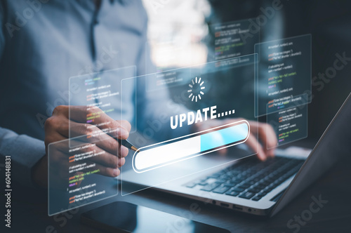 Man using laptop with Update Software Computer Program Upgrade Business Technology Internet, Update on virtual screen. Internet and technology concept, loading bar with installing the update,